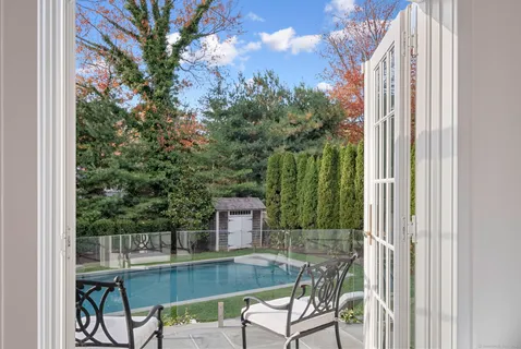 a view of a balcony with chairs