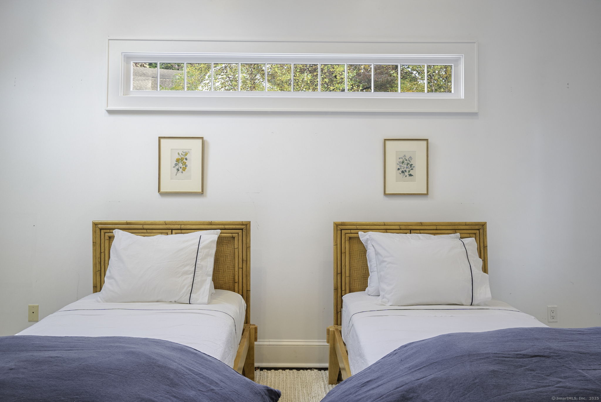 1 Flicker Lane Norwalk, CT 06853 - Photo 24 of 39 a bedroom with a bed and a painting on the wall