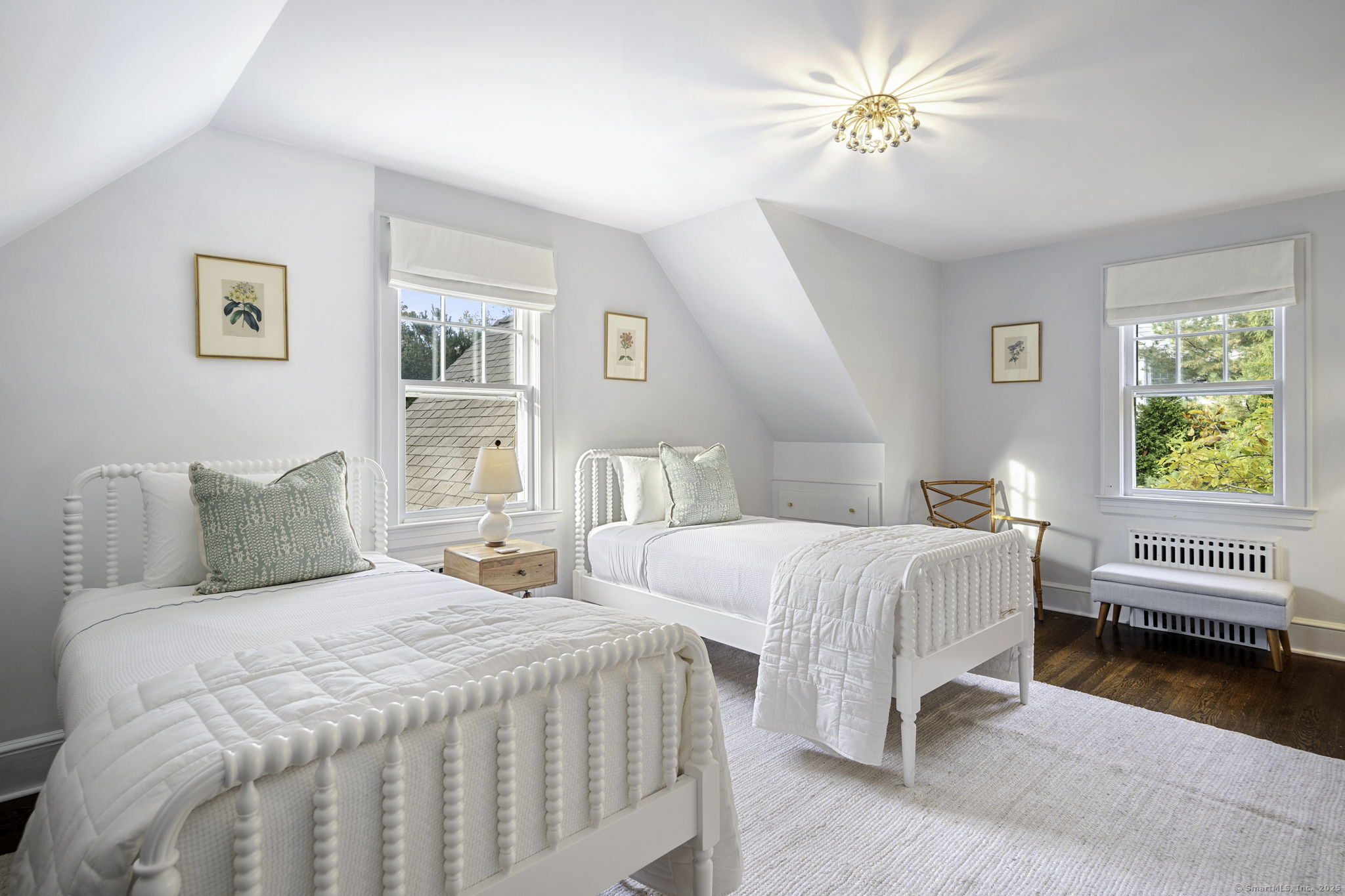 1 Flicker Lane Norwalk, CT 06853 - Photo 28 of 39 a bedroom with two beds and a chandelier