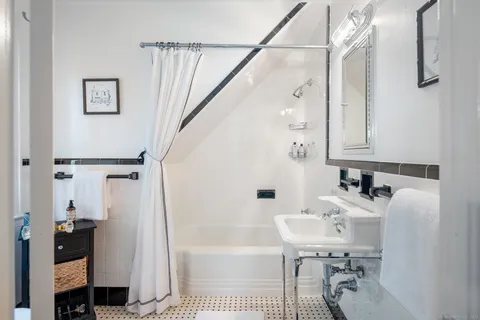 a bathroom with a sink a toilet and a bathtub