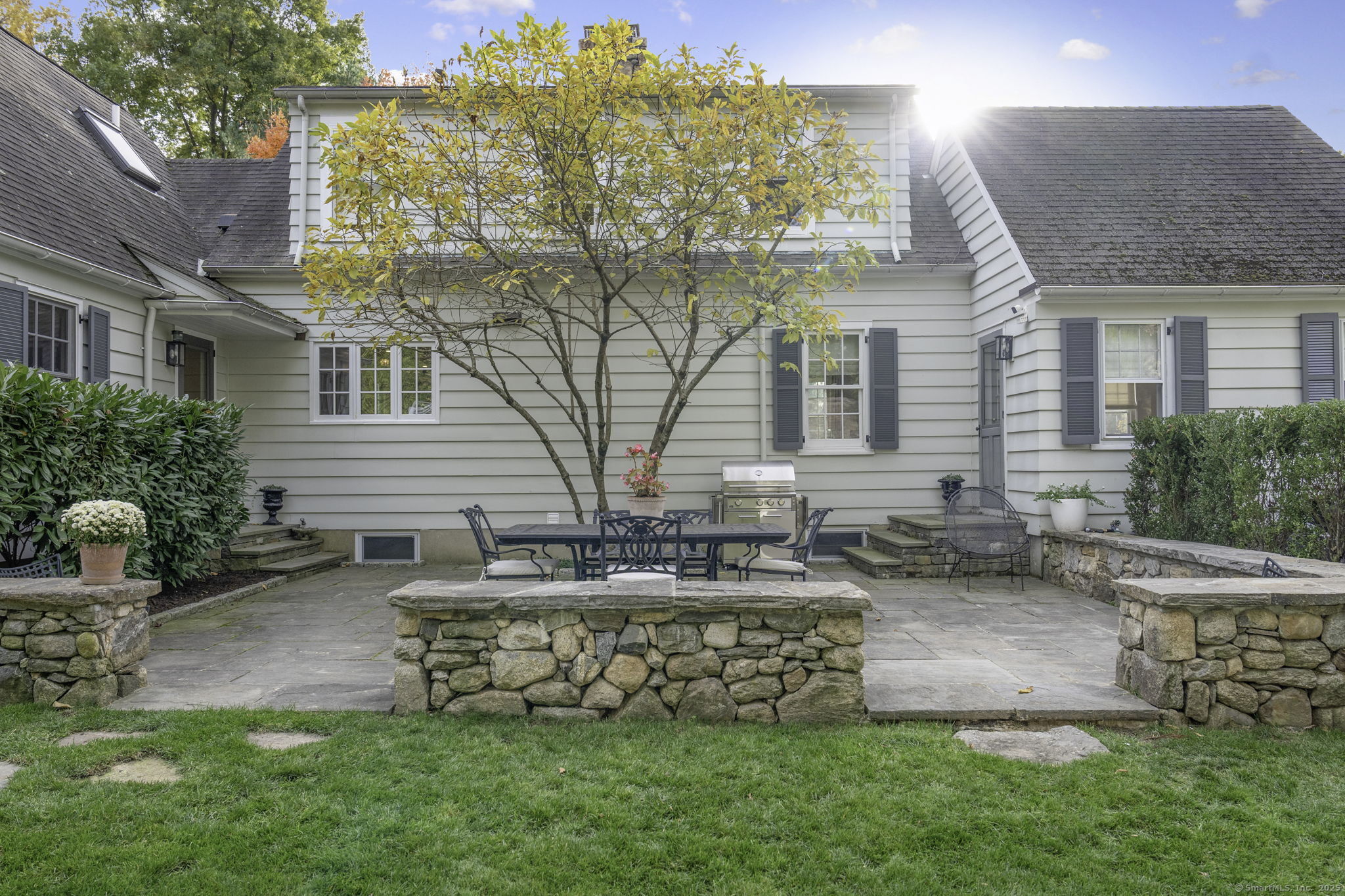 1 Flicker Lane Norwalk, CT 06853 - Photo 32 of 39 a front view of a house with garden