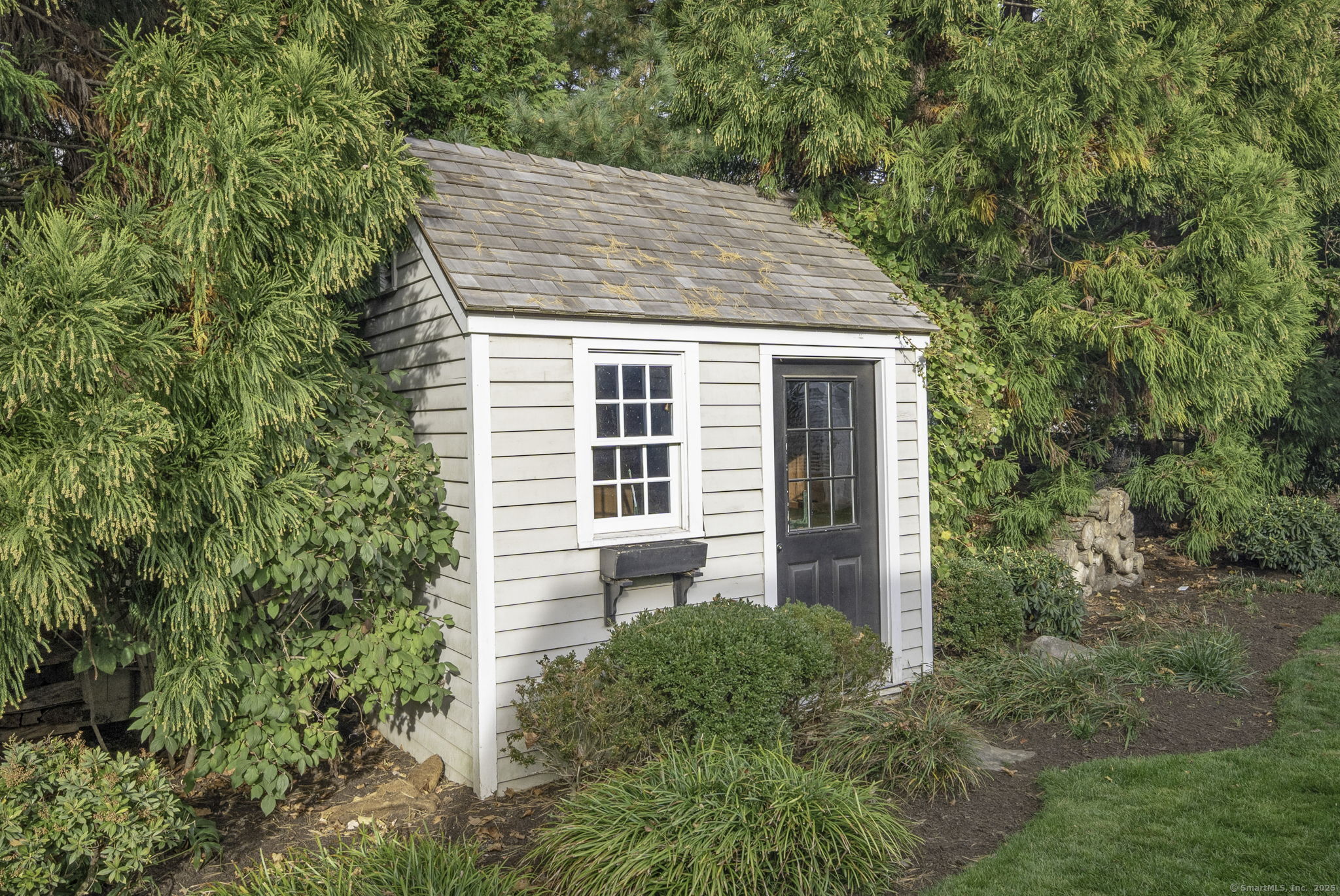 1 Flicker Lane Norwalk, CT 06853 - Photo 33 of 39 a front view of a house with garden