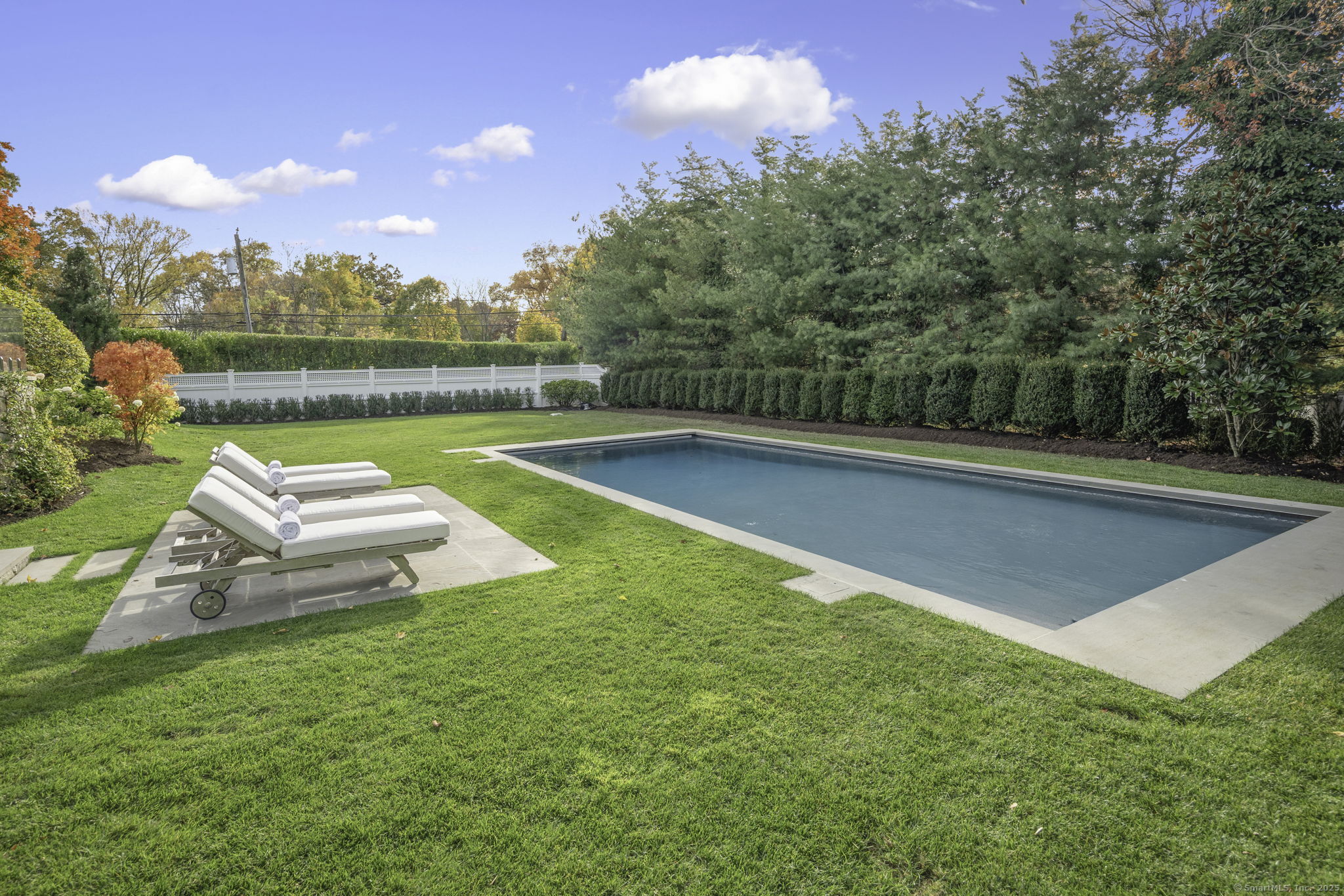 1 Flicker Lane Norwalk, CT 06853 - Photo 34 of 39 a view of a swimming pool with a patio and a yard