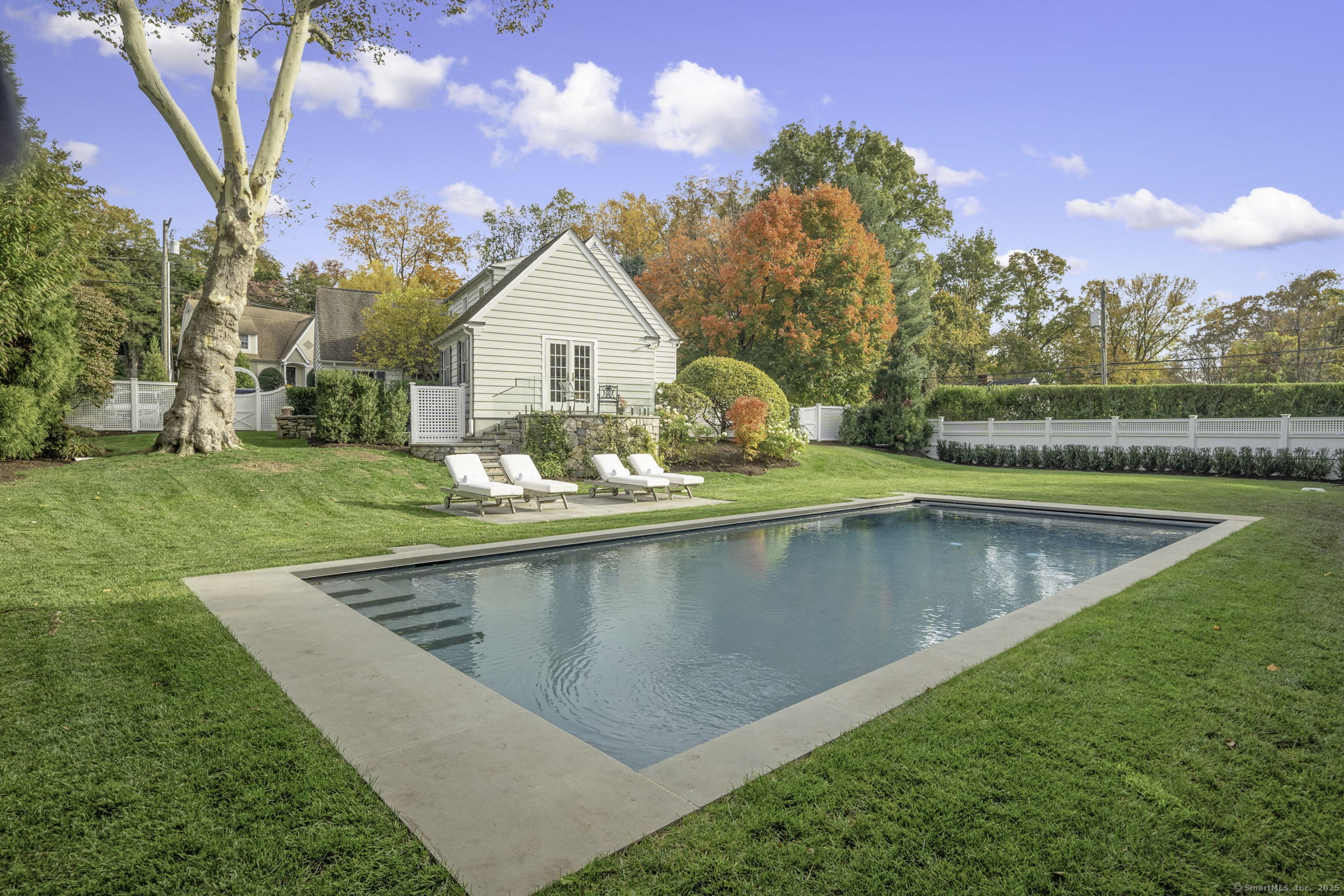 1 Flicker Lane Norwalk, CT 06853 - Photo 35 of 39 a view of a house with swimming pool and a yard