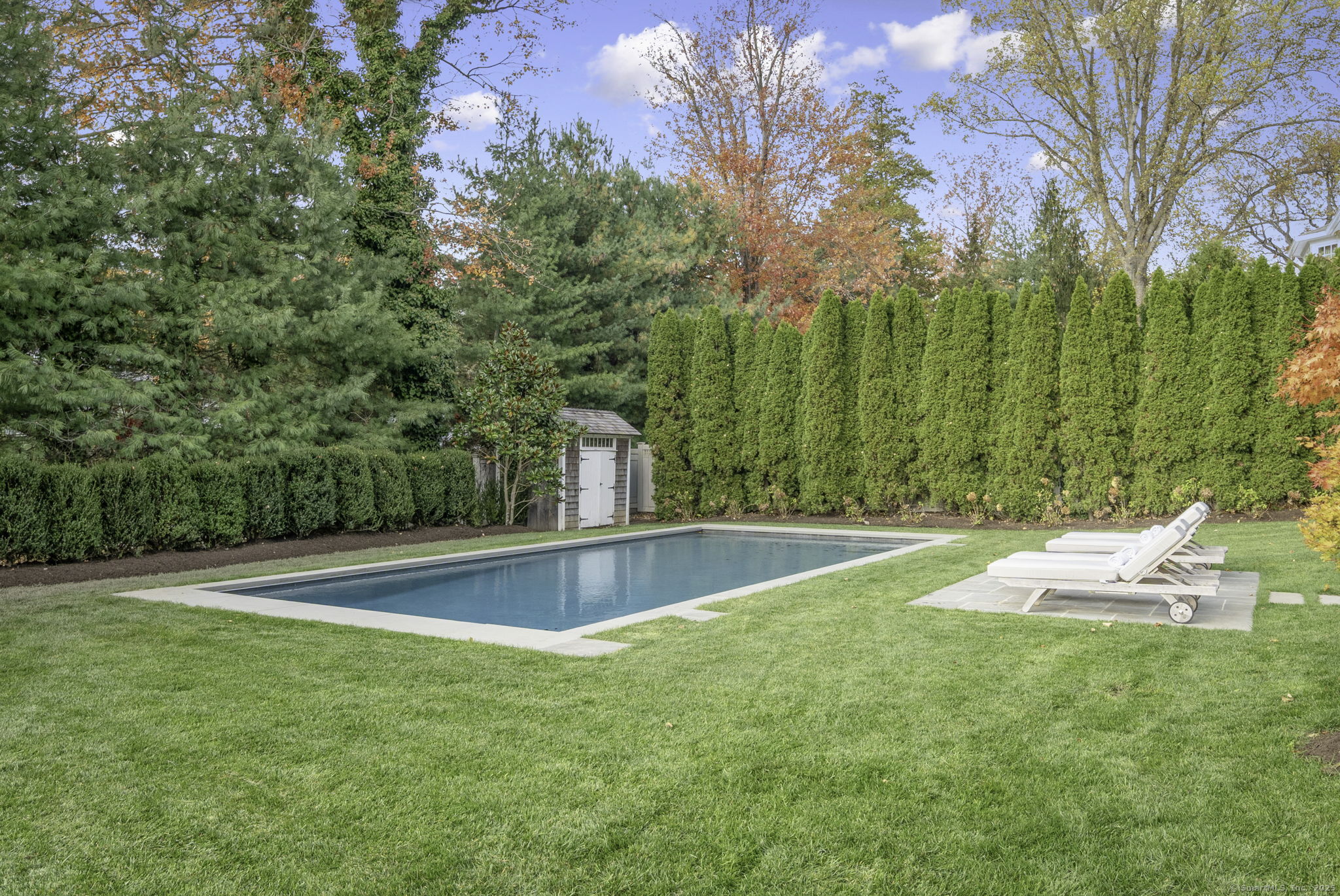 1 Flicker Lane Norwalk, CT 06853 - Photo 38 of 39 a view of a swimming pool with a yard
