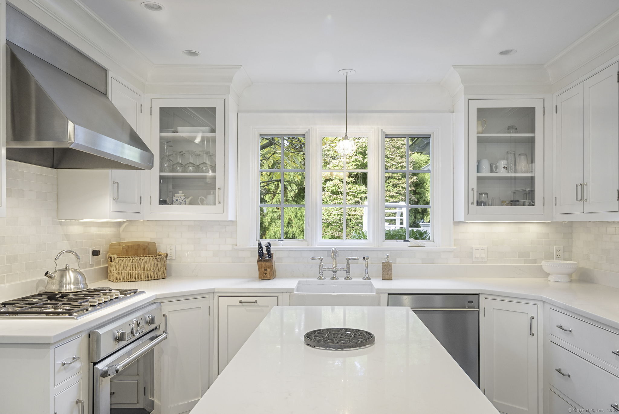 1 Flicker Lane Norwalk, CT 06853 - Photo 9 of 39 a kitchen with a sink stove and cabinets