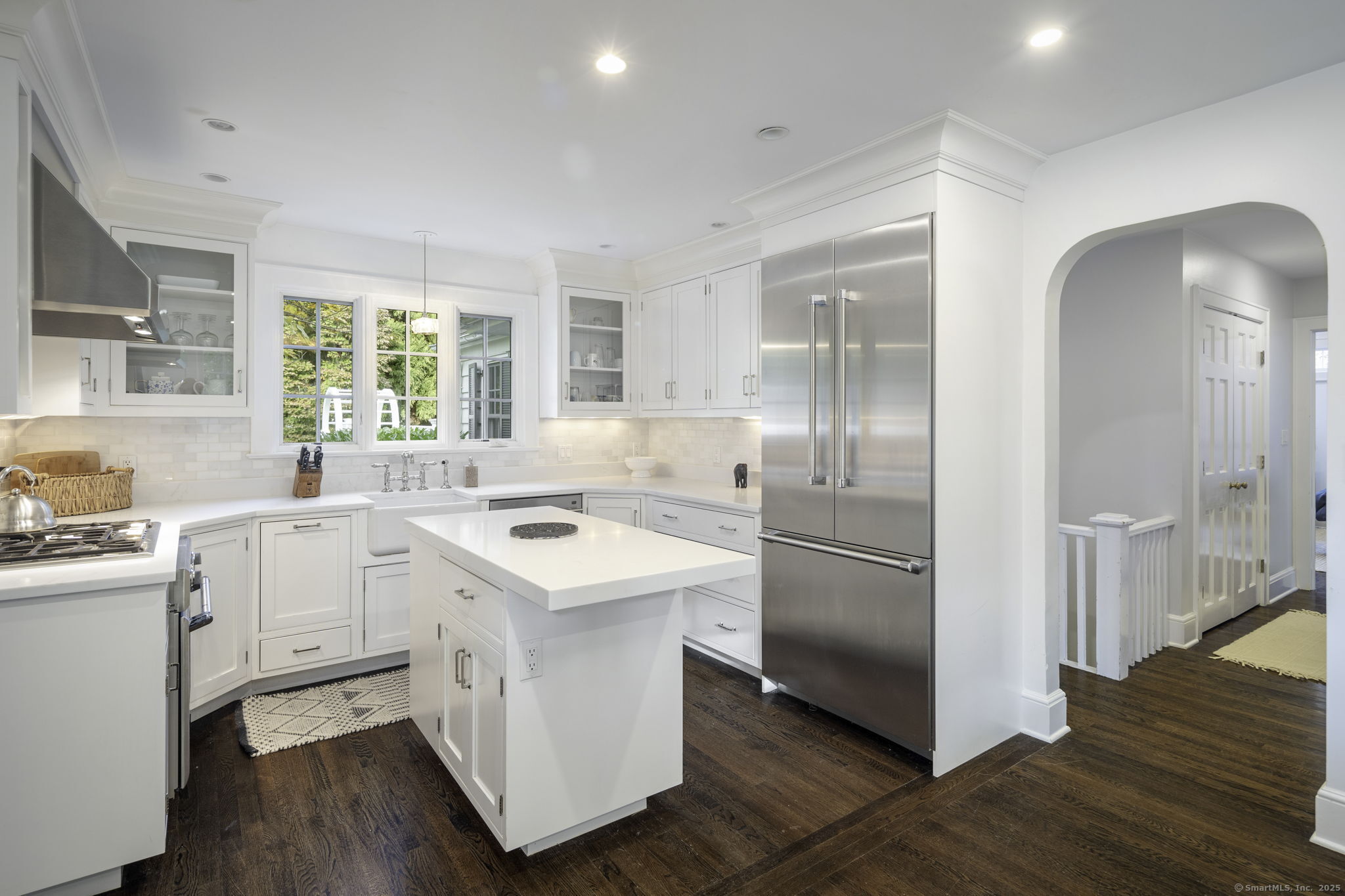 1 Flicker Lane Norwalk, CT 06853 - Photo 10 of 39 a kitchen with white cabinets and white appliances