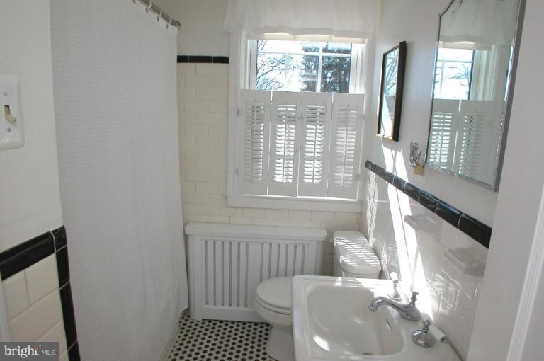 6461 Blenheim Road Baltimore, MD 21212 - Photo 12 of 20 a bathroom with a sink and a toilet