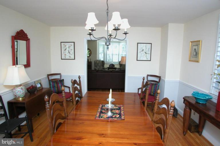 6461 Blenheim Road Baltimore, MD 21212 - Photo 7 of 20 a living room with dining table furniture and a chandelier