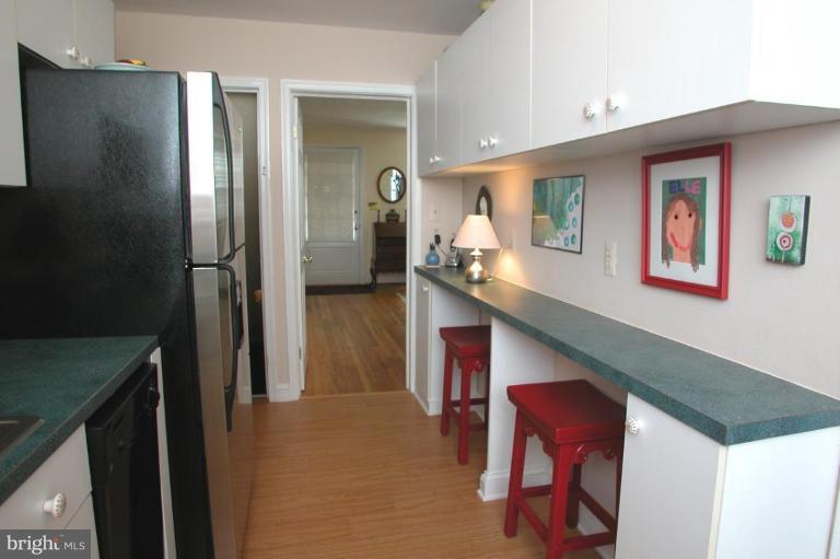 6461 Blenheim Road Baltimore, MD 21212 - Photo 10 of 20 a kitchen with stainless steel appliances granite countertop a refrigerator and a stove