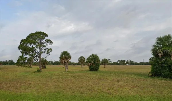 a view of a lake with a big yard
