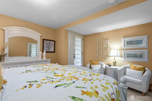 a bedroom with a bed and a couch