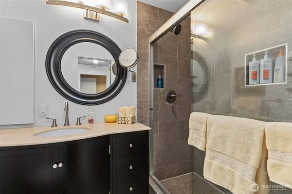 a bathroom with a sink and a mirror