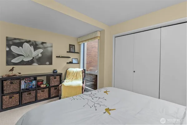 a bedroom with a bed and a couch