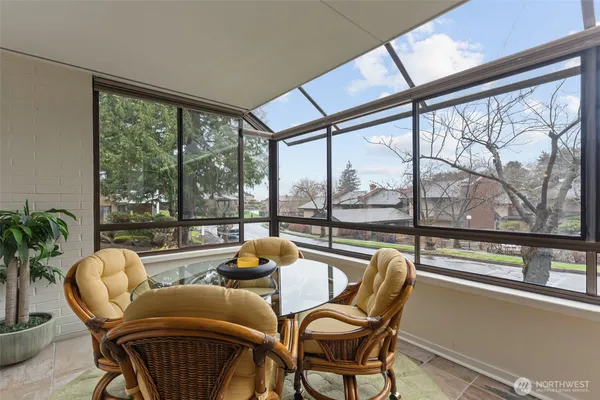 a view of a city from a dining room with furniture window and outside view