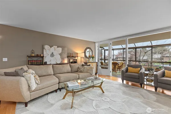 a living room with furniture and a large window