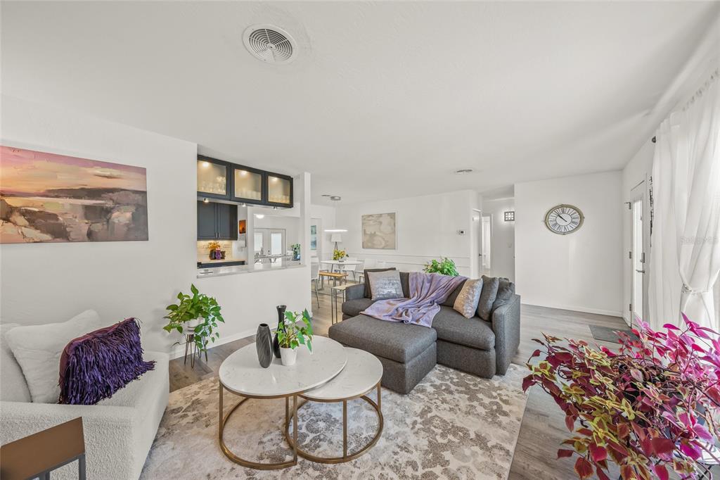 2427 Tulip Street Sarasota, FL 34239 - Photo 16 of 39 a living room with furniture and flowers