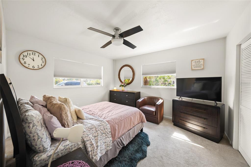 2427 Tulip Street Sarasota, FL 34239 - Photo 19 of 39 a living room with furniture a window and a flat screen tv