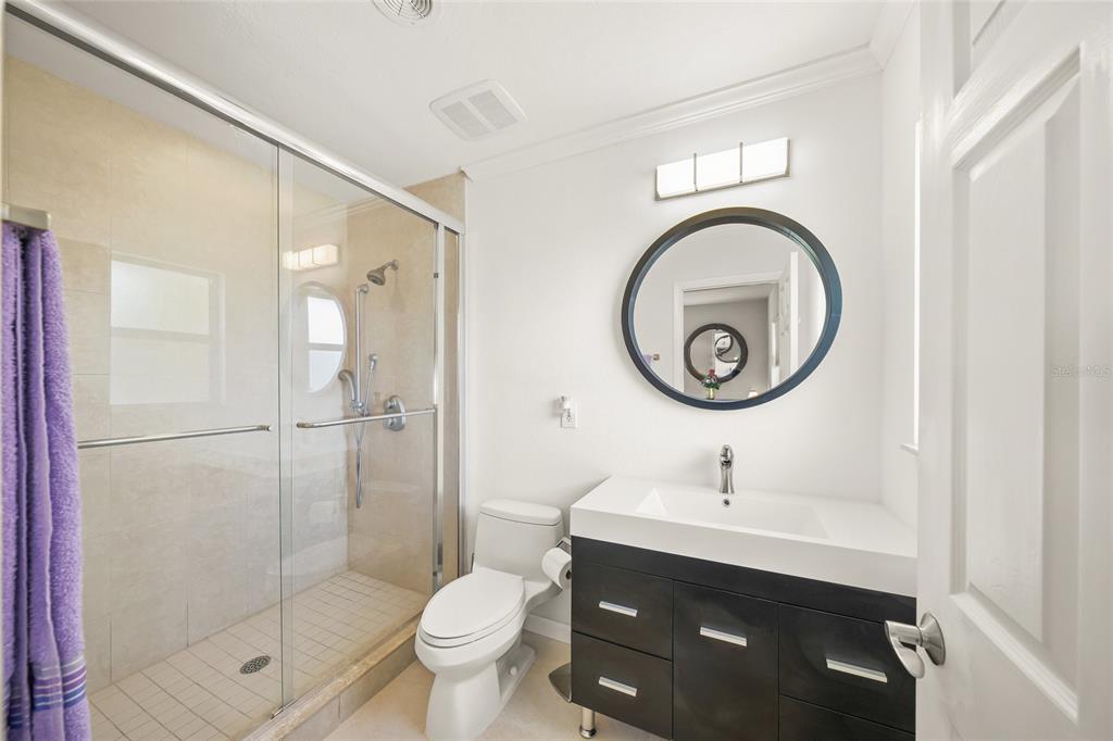 2427 Tulip Street Sarasota, FL 34239 - Photo 20 of 39 a bathroom with a sink toilet and a shower