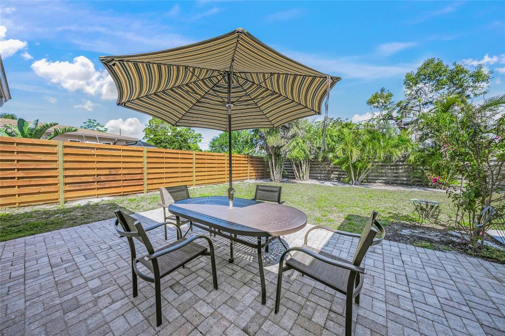 2427 Tulip Street Sarasota, FL 34239 - Photo 22 of 39 a view of a chair and table in the patio
