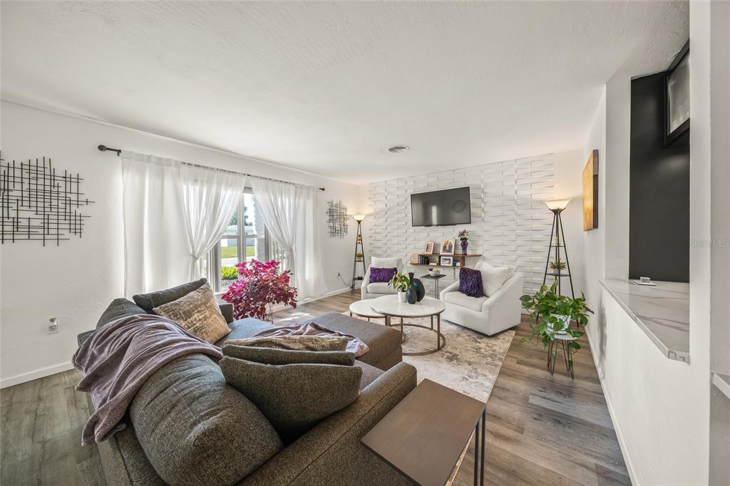 2427 Tulip Street Sarasota, FL 34239 - Photo 6 of 39 a living room with furniture and a flat screen tv