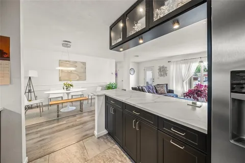 a kitchen with a sink and cabinets