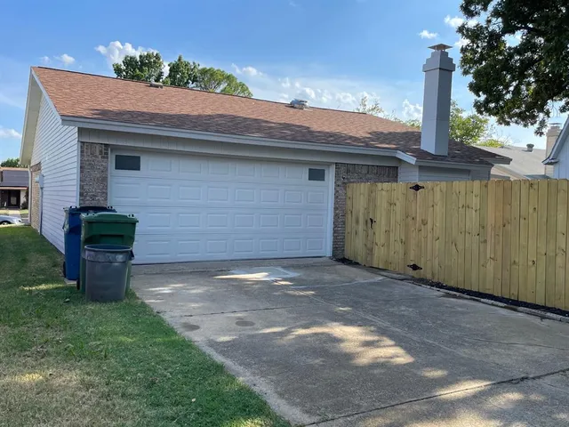 a view of a backyard of the house