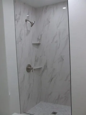 a bathroom with a sink and mirror