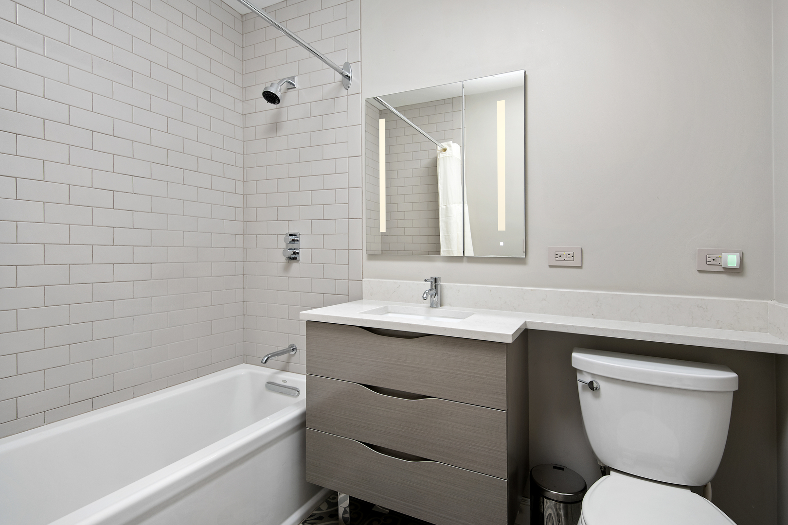 421 West Melrose Street, Unit 18BC Chicago, IL 60657 - Photo 18 of 29 a bathroom with a toilet sink and mirror