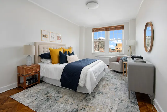 a bathroom with a sink a toilet a shower and a mirror