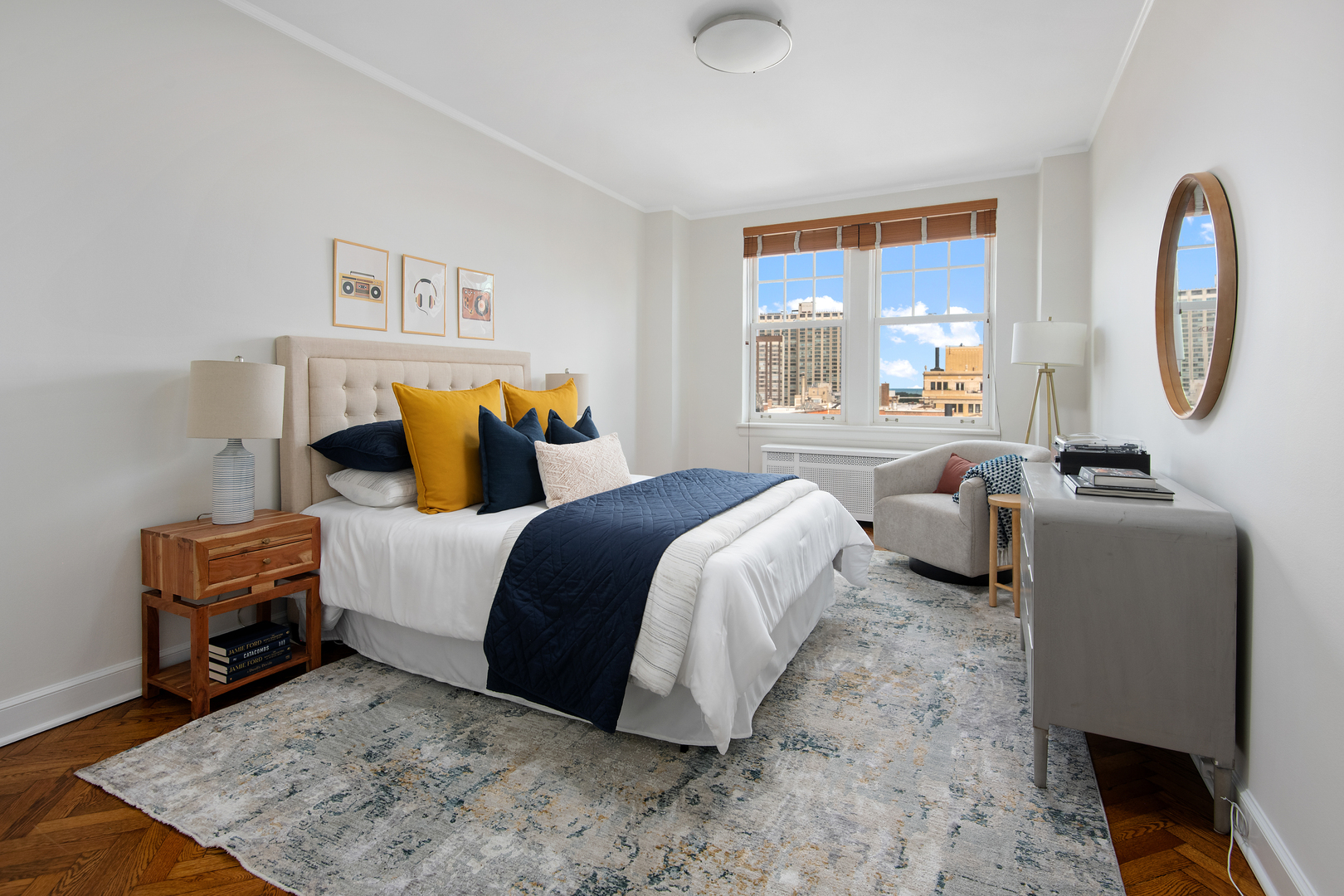 421 West Melrose Street, Unit 18BC Chicago, IL 60657 - Photo 19 of 29 a bedroom with a bed a couch and a window