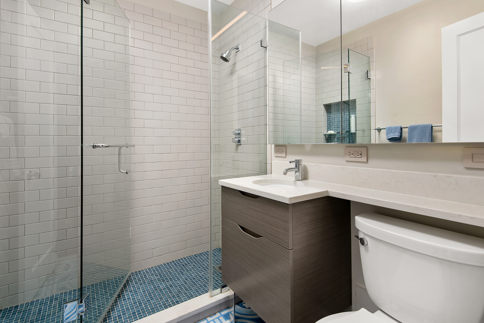 421 West Melrose Street, Unit 18BC Chicago, IL 60657 - Photo 20 of 29 a bathroom with a sink a toilet a shower and a mirror