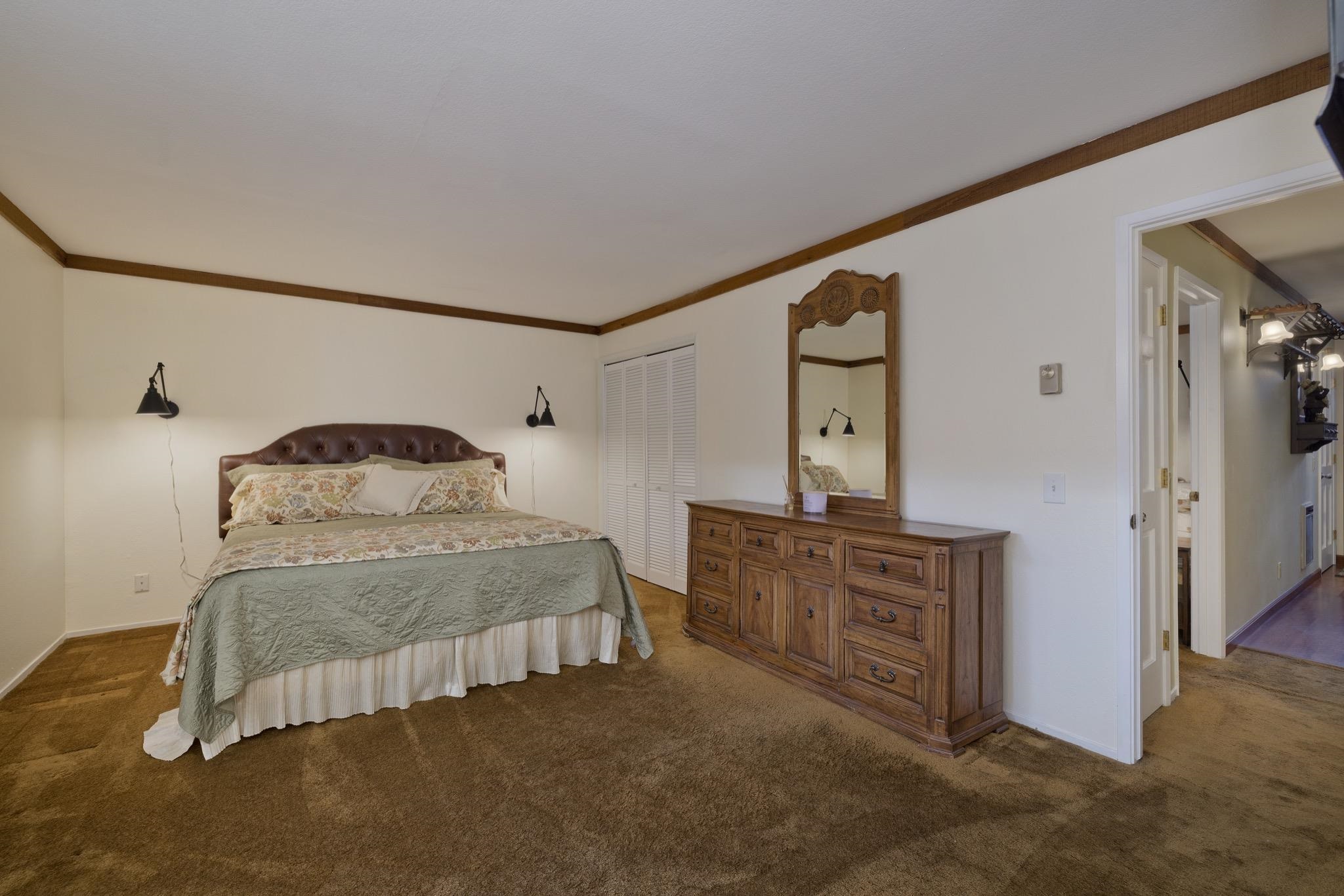 484 Manzanita Road, Unit 16 Mammoth Lakes, CA 93546 - Photo 29 of 34 a bedroom with a bed and a dresser