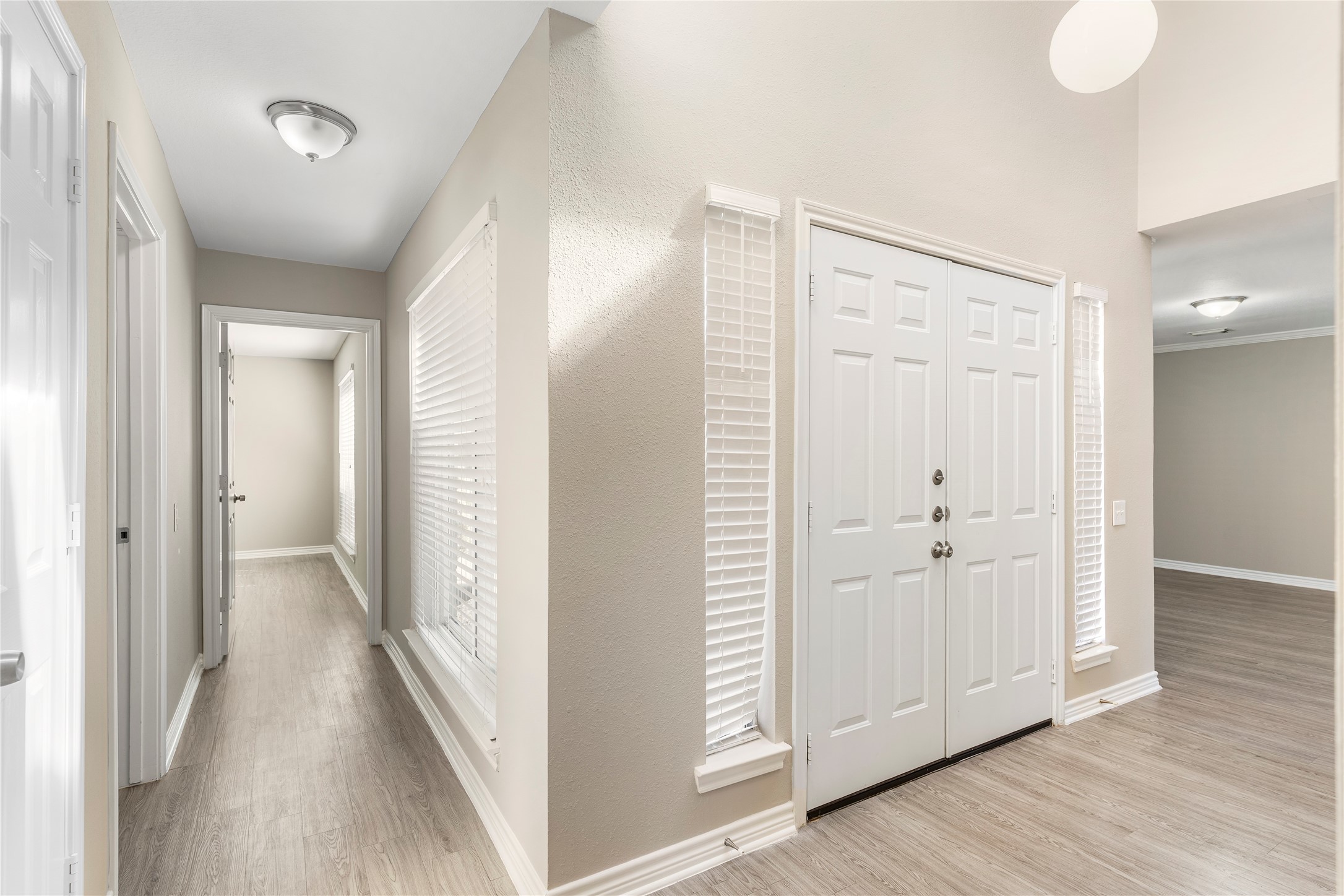 2007 Fernspray Lane Houston, TX 77084 - Photo 18 of 34 a view of a hallway with wooden floor