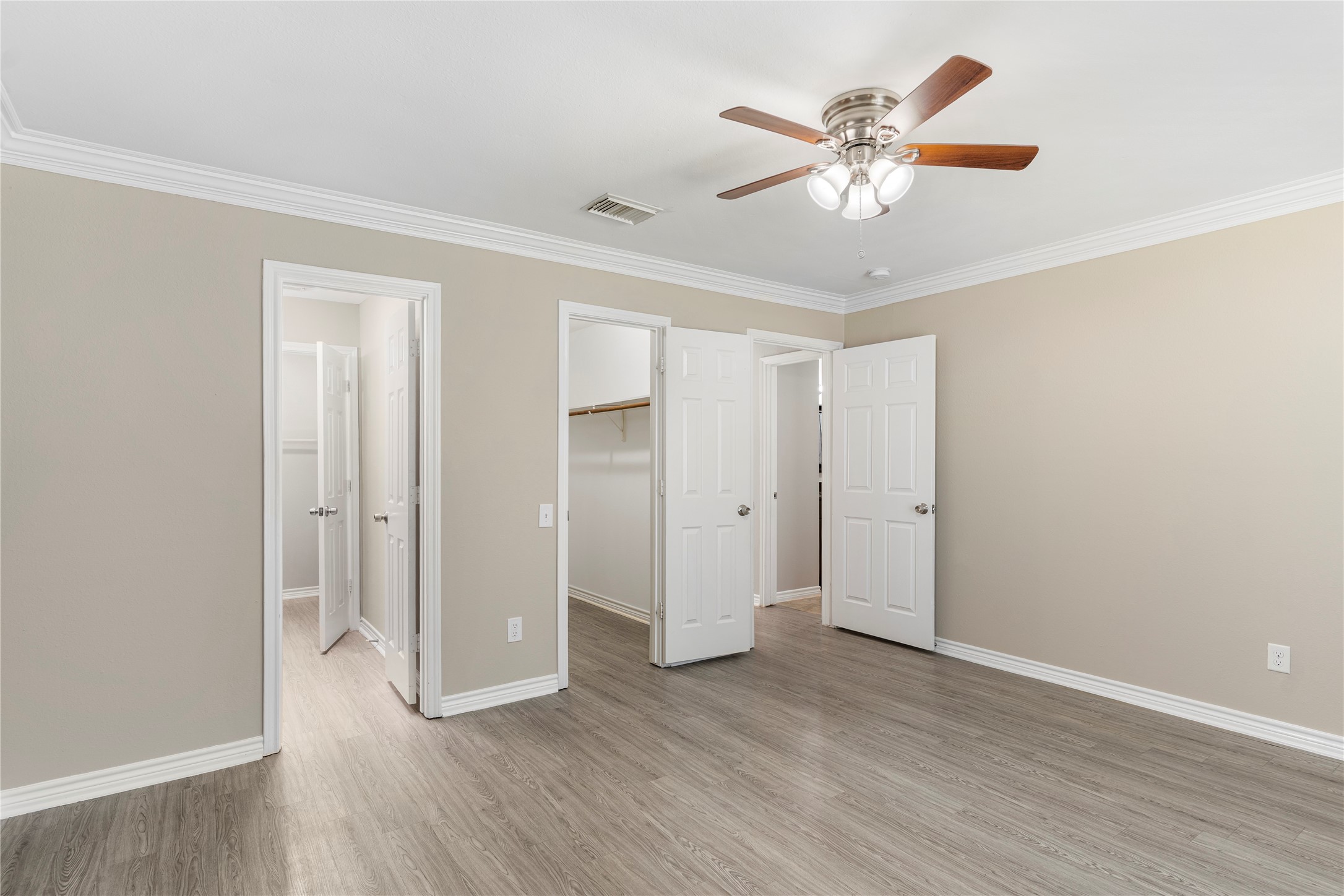 2007 Fernspray Lane Houston, TX 77084 - Photo 20 of 34 an empty room with wooden floor and ceiling fan