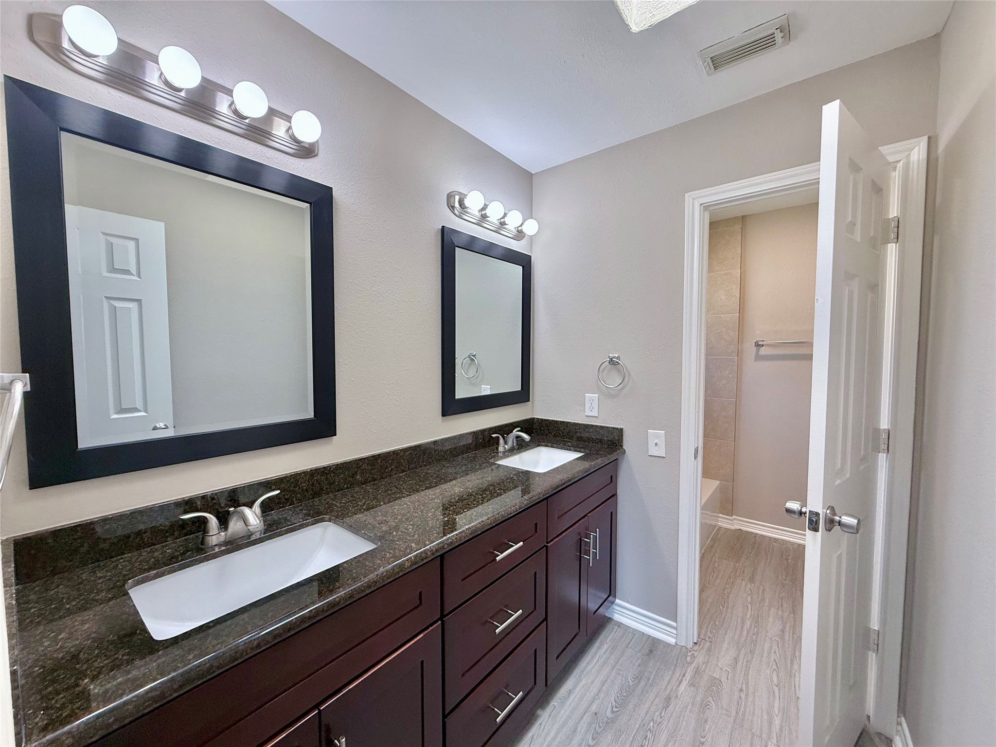 2007 Fernspray Lane Houston, TX 77084 - Photo 21 of 34 a bathroom with a granite countertop sink vanity and mirror