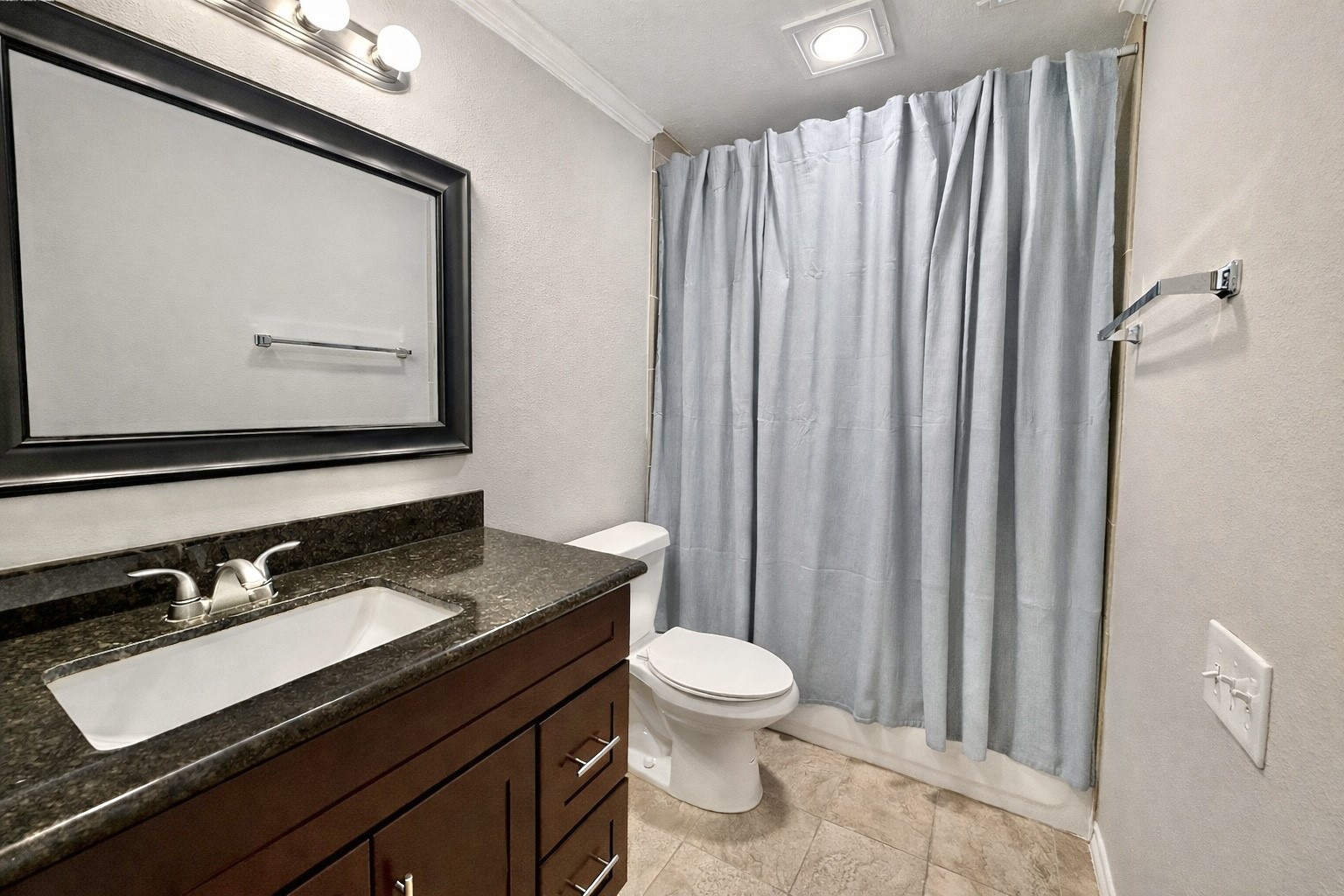 2007 Fernspray Lane Houston, TX 77084 - Photo 25 of 34 a bathroom with a granite countertop sink vanity mirror and toilet