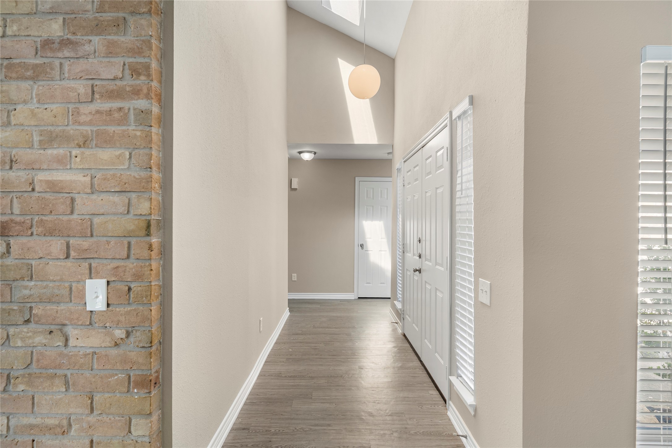 2007 Fernspray Lane Houston, TX 77084 - Photo 9 of 34 a view of a hallway with windows