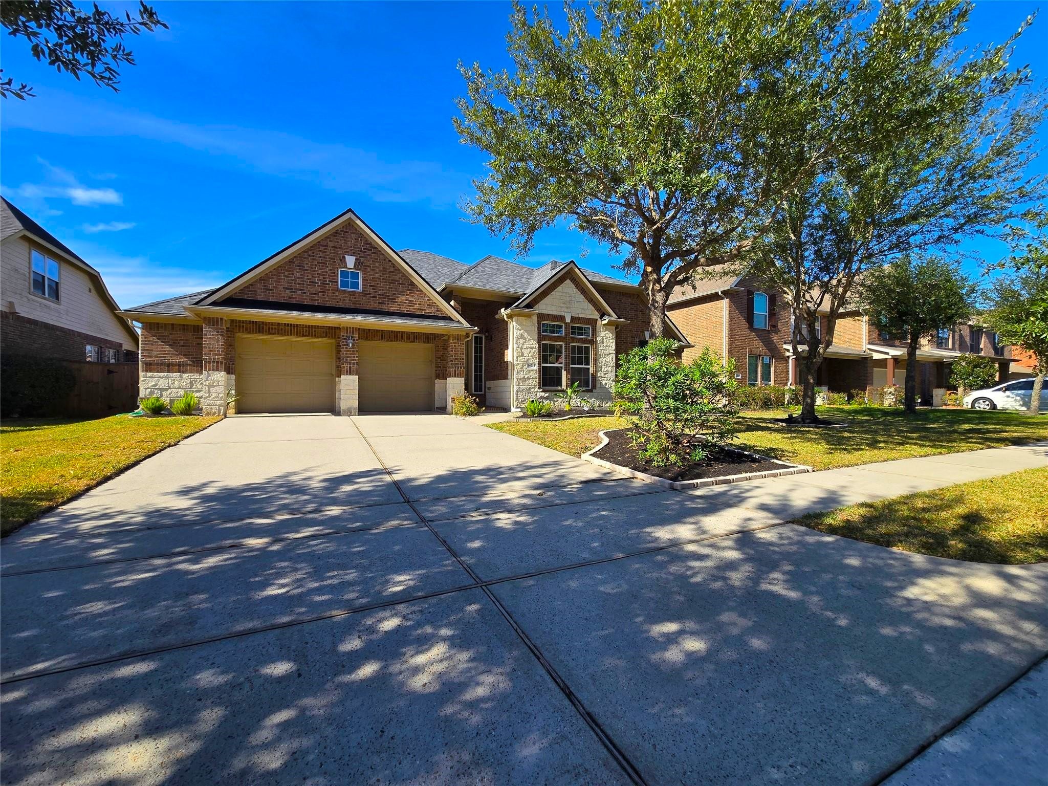 14015 Hailey Springs Lane Humble, TX 77396 - Photo 2 of 34 a front view of a house with a yard