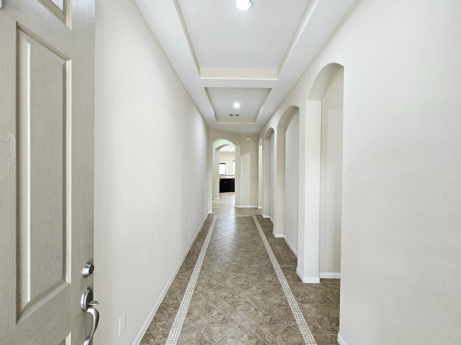 14015 Hailey Springs Lane Humble, TX 77396 - Photo 3 of 34 a view of a hallway with wooden floor and staircase