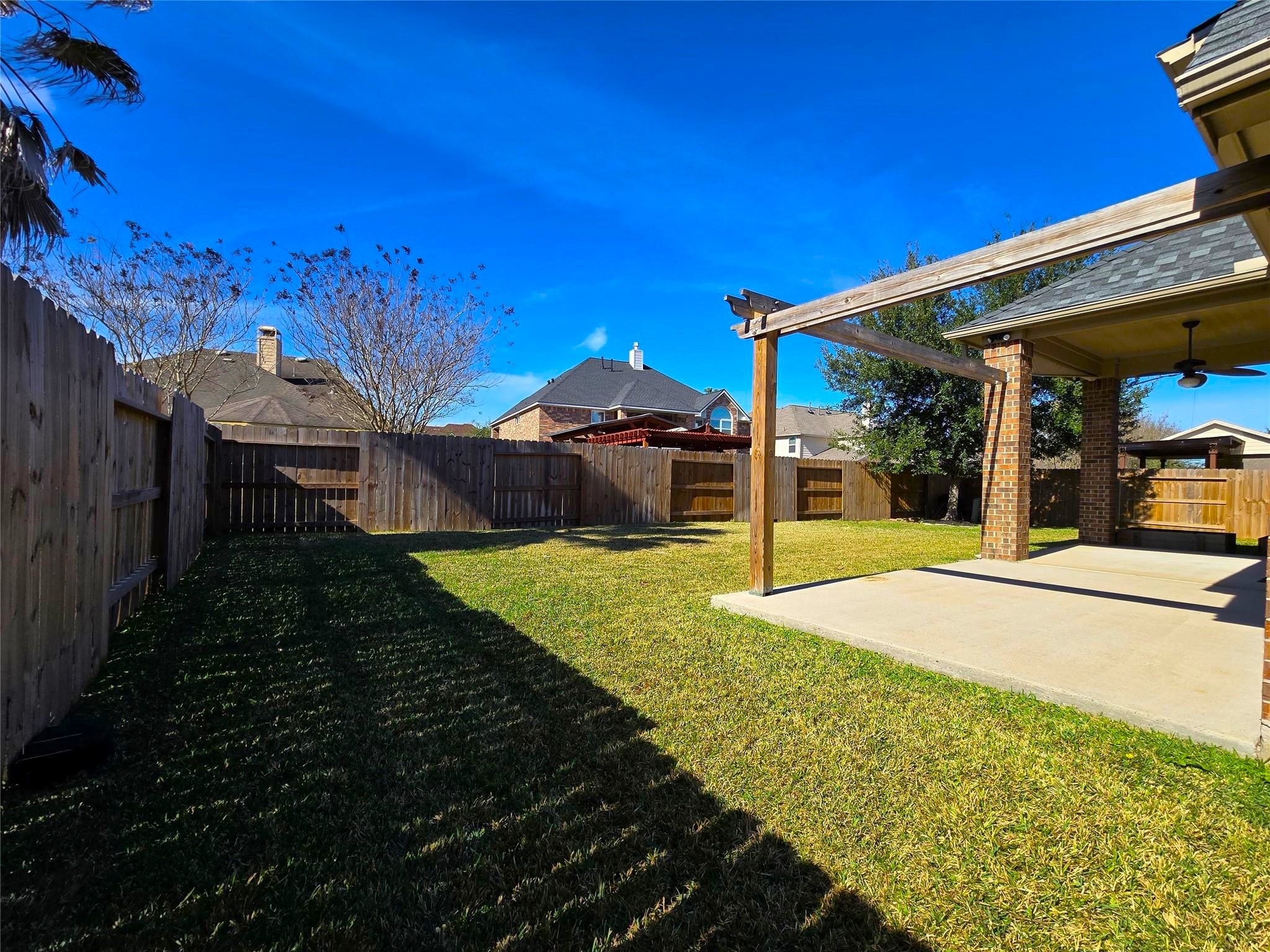 14015 Hailey Springs Lane Humble, TX 77396 - Photo 32 of 34 a view of a house with backyard and porch