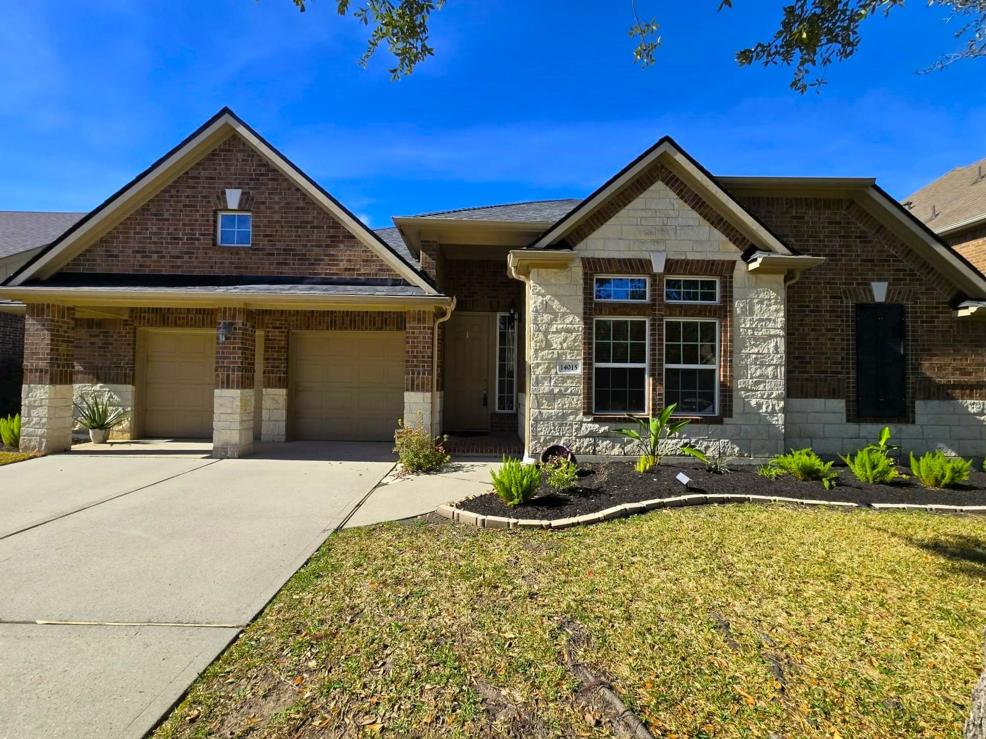 14015 Hailey Springs Lane Humble, TX 77396 - Photo 33 of 34 a front view of a house with a yard