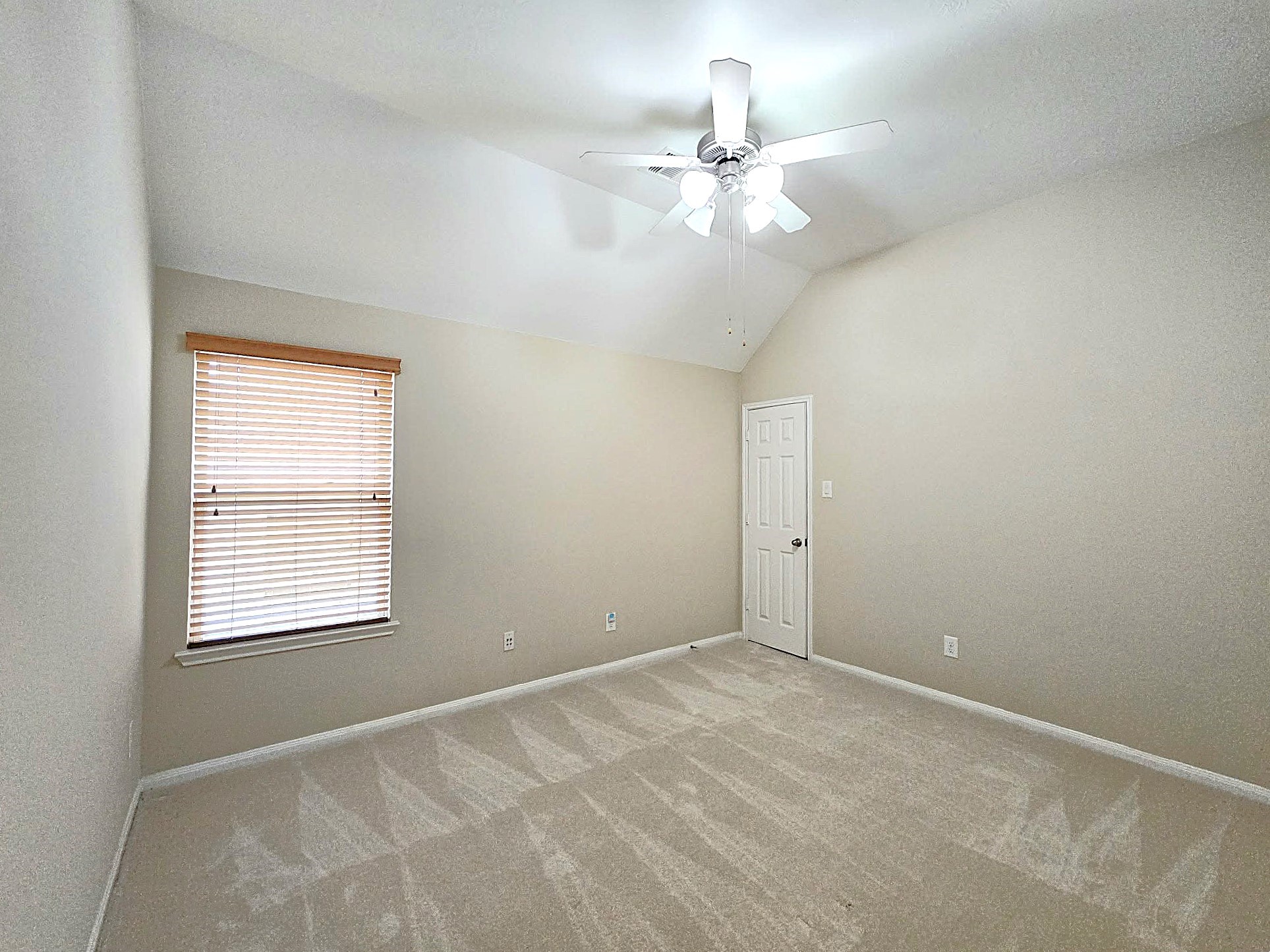 14015 Hailey Springs Lane Humble, TX 77396 - Photo 7 of 34 a view of an empty room with a window