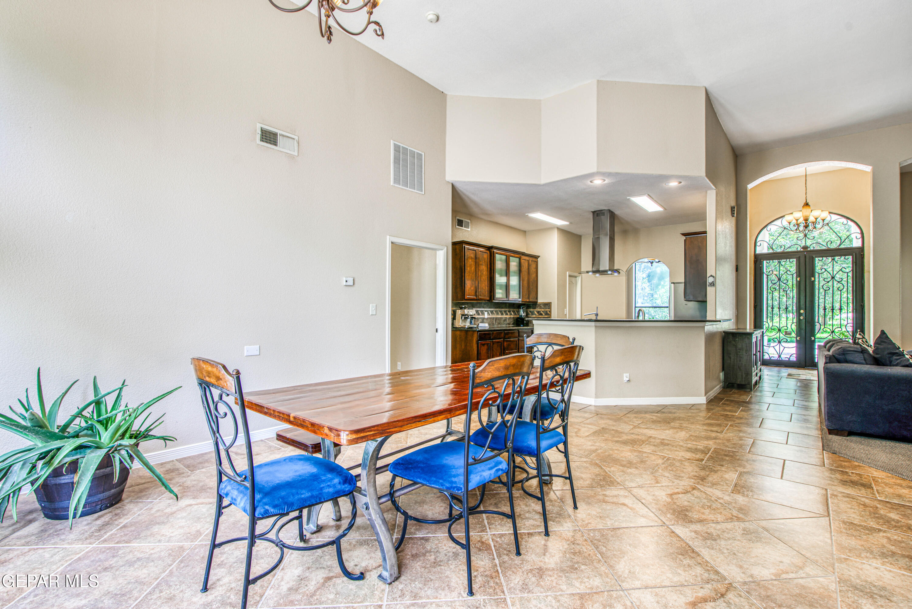 617 Wallace Road Anthony, NM 88021 - Photo 18 of 87 a view of a dining room with furniture and a floor to ceiling window
