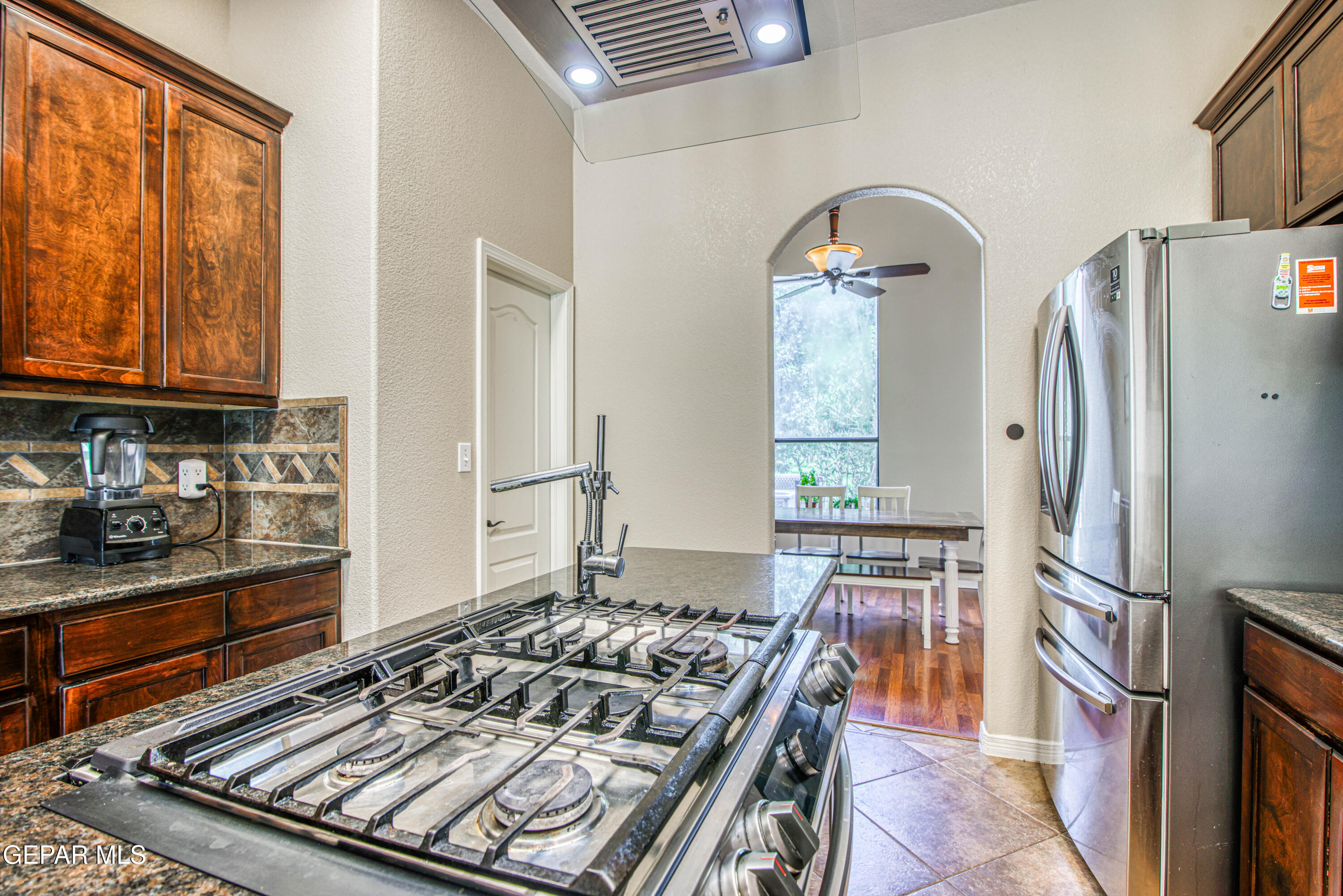 617 Wallace Road Anthony, NM 88021 - Photo 24 of 87 a kitchen with stainless steel appliances granite countertop a stove and a refrigerator