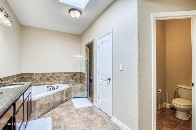 a view of a house with backyard and a tree