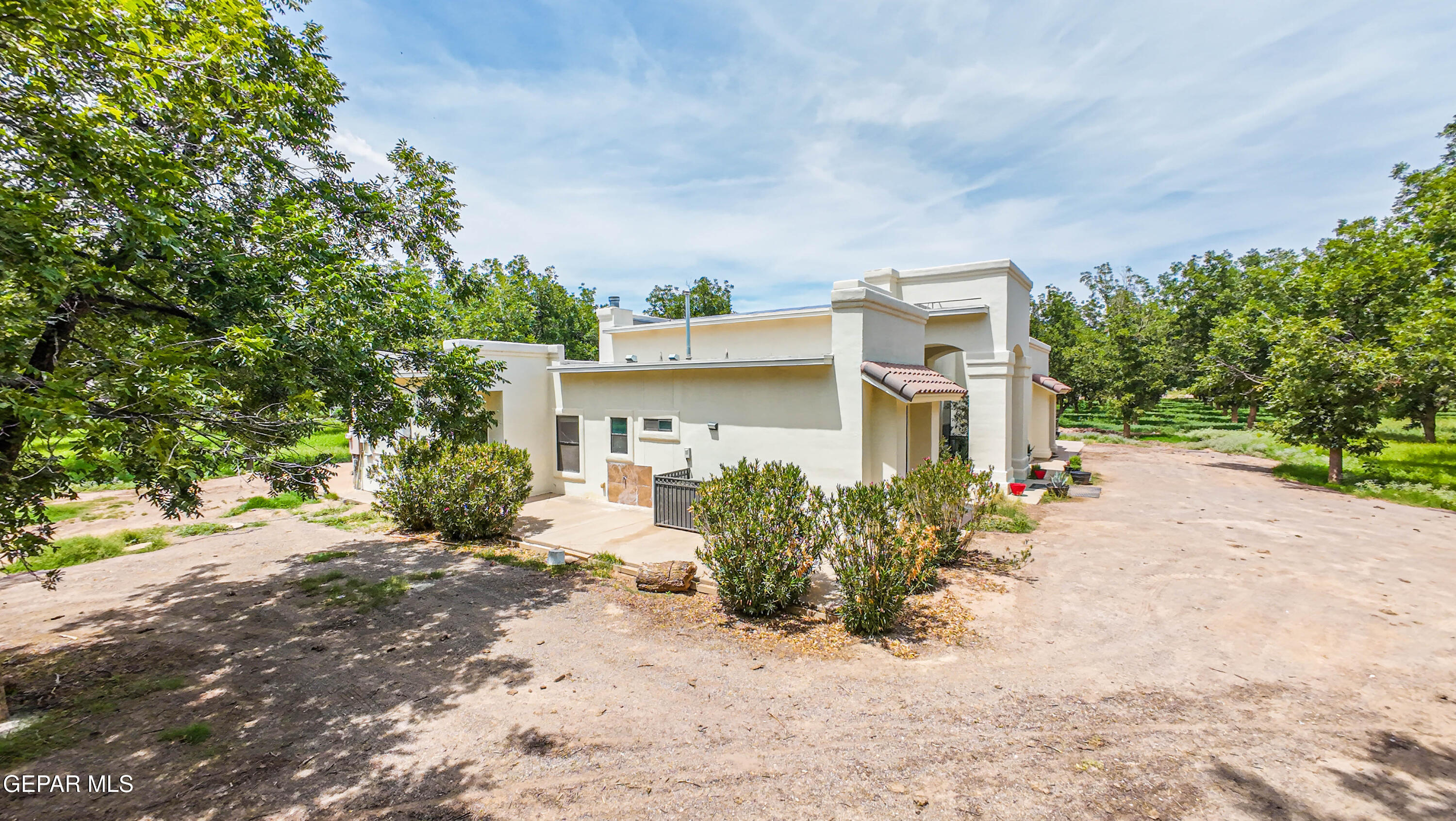 617 Wallace Road Anthony, NM 88021 - Photo 63 of 87 a front view of a house with a yard and a garage