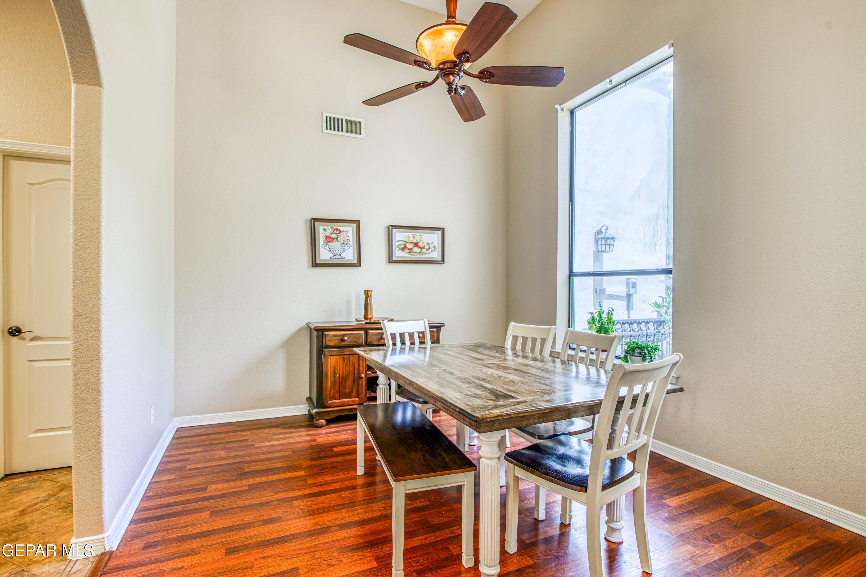 617 Wallace Road Anthony, NM 88021 - Photo 8 of 87 a view of a dining room with furniture and wooden floor