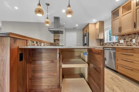 a kitchen with a refrigerator and a sink