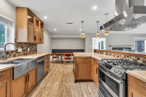 a kitchen with a stove and a sink